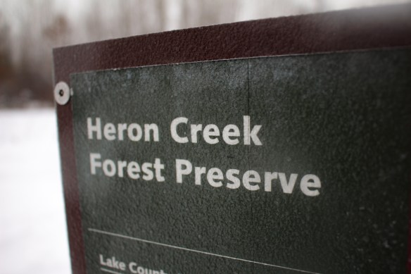 The title of a navigational sign painted over with ice. Photo © Lake County Forest Preserves.