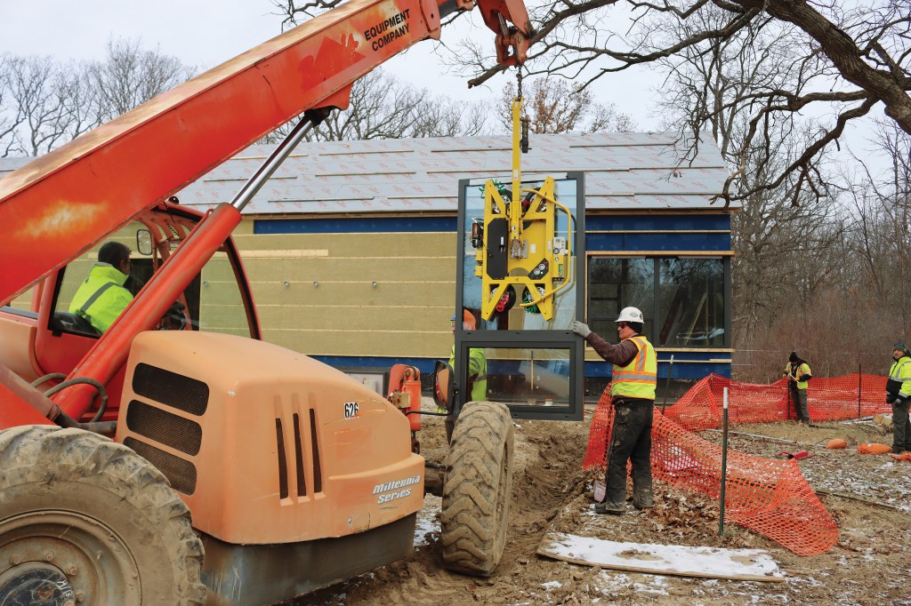Construction crews worked within limited space to protect the surrounding trees.