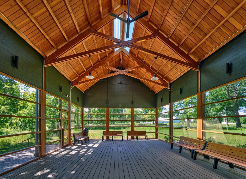Bronze screens and rich wood tones make the interior of the North Shore Gas Outdoor Classroom feel secluded. Photo © John Weinstein.
