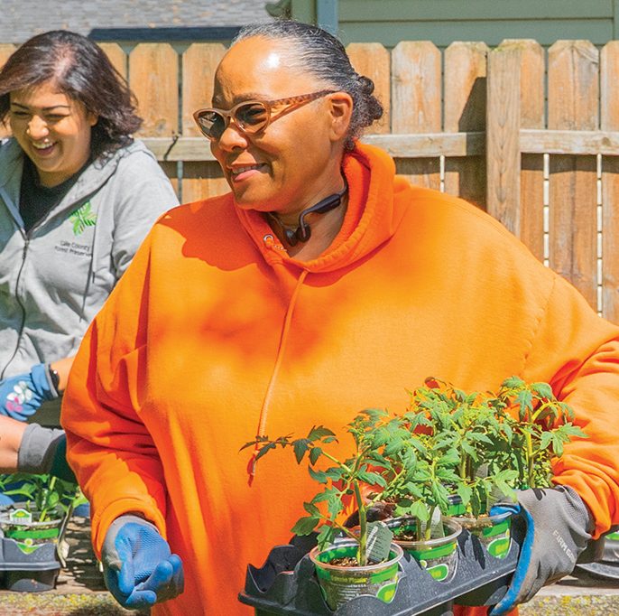 Volunteer Kay Ross grows tomatoes, pumpkins, corn and other produce.