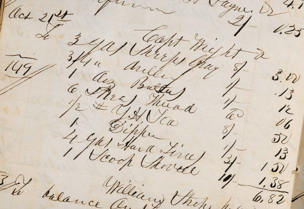 A historical store ledger listing purchased items and prices in flowy handwriting.